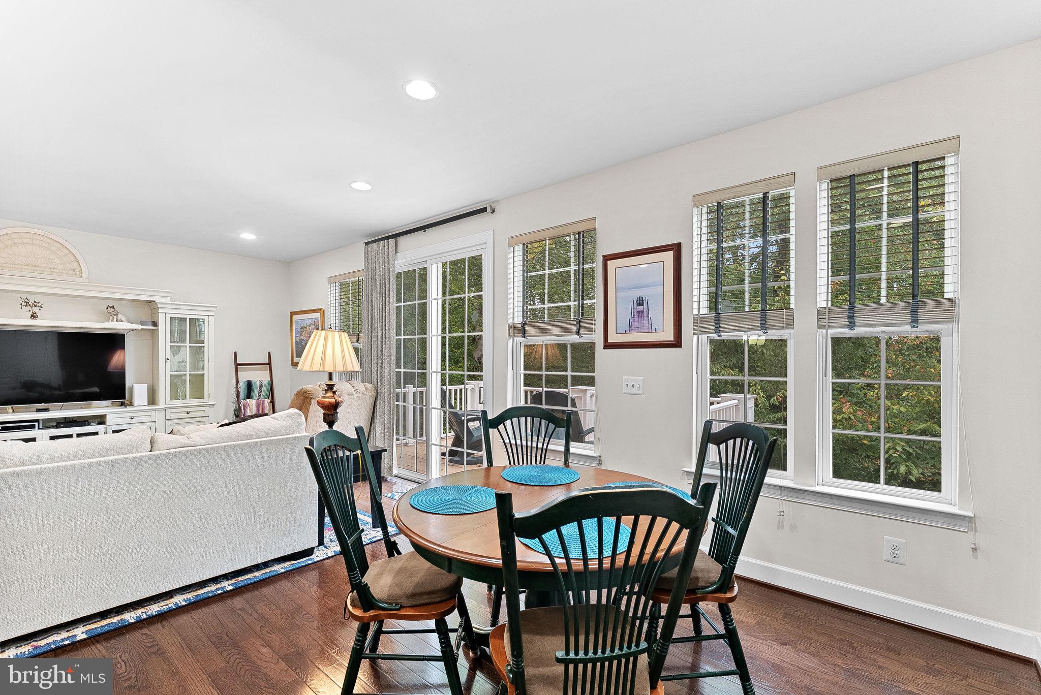 20281 Center Brook Square Sterling, VA 20165 - Photo 12 of 51 a view of a dining room with furniture window and wooden floor