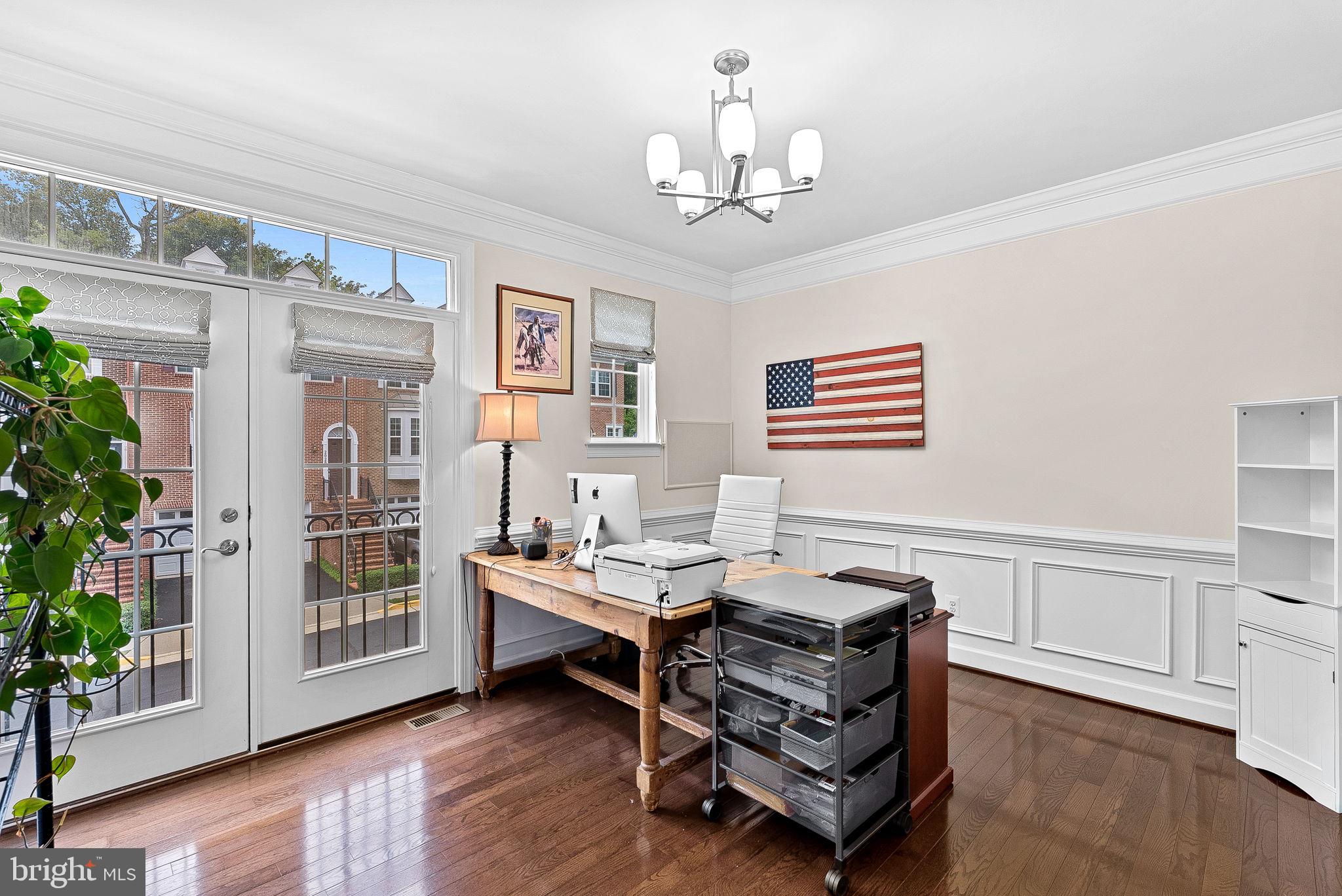20281 Center Brook Square Sterling, VA 20165 - Photo 20 of 51 a bedroom with furniture and a chandelier