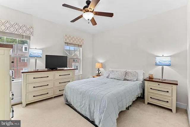 a bedroom with a bed and a television