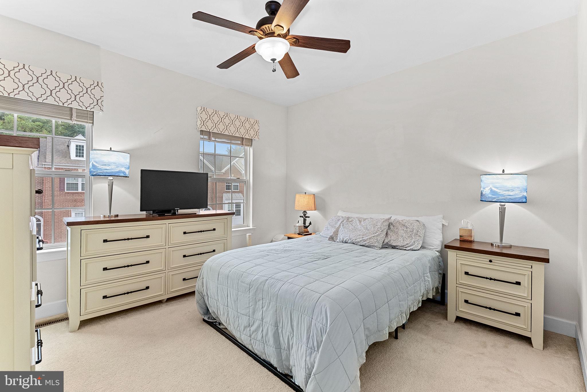 20281 Center Brook Square Sterling, VA 20165 - Photo 28 of 51 a bedroom with a bed and a television