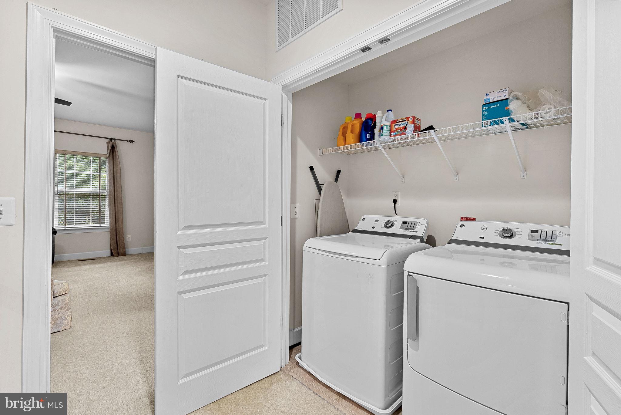 20281 Center Brook Square Sterling, VA 20165 - Photo 30 of 51 a view of storage and utility room with washer and dryer