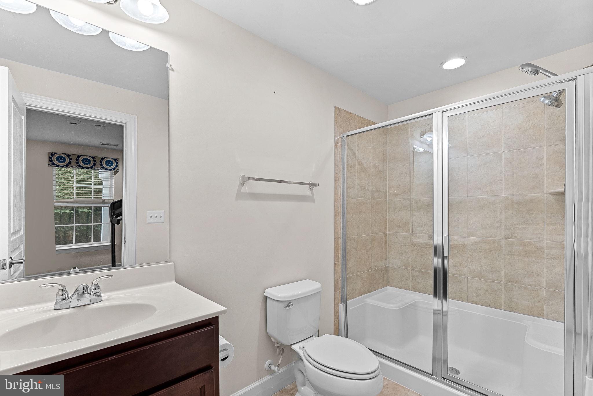 20281 Center Brook Square Sterling, VA 20165 - Photo 32 of 51 a bathroom with a sink toilet and shower