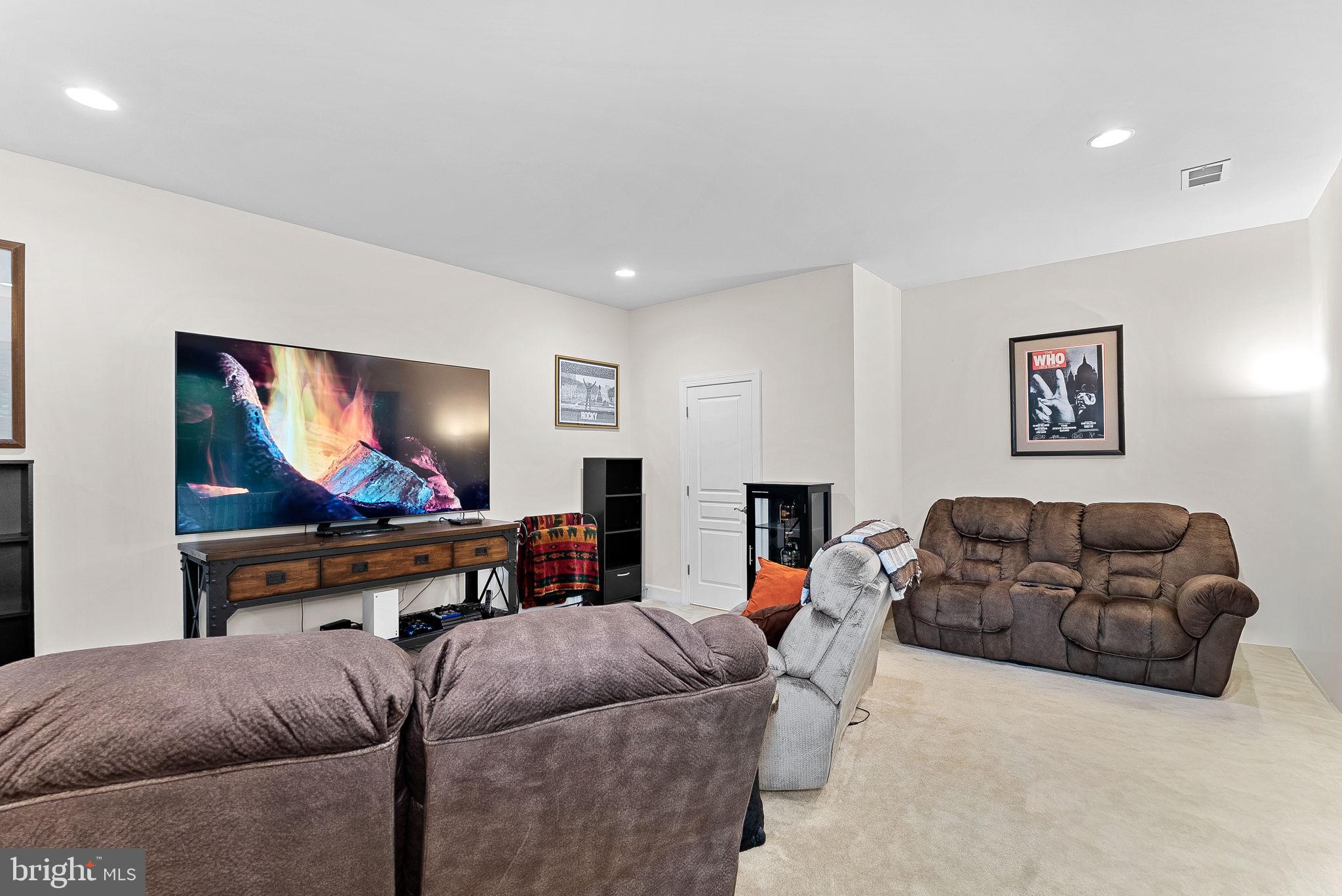 20281 Center Brook Square Sterling, VA 20165 - Photo 35 of 51 a living room with furniture and a flat screen tv