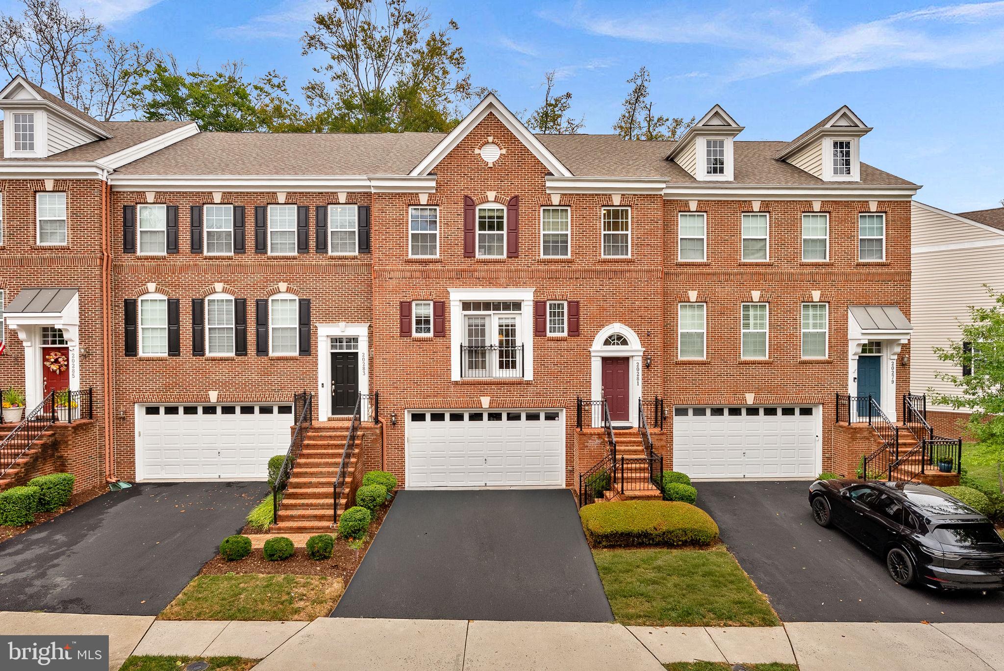 20281 Center Brook Square Sterling, VA 20165 - Photo 4 of 51 front view of a residential apartment building with a yard