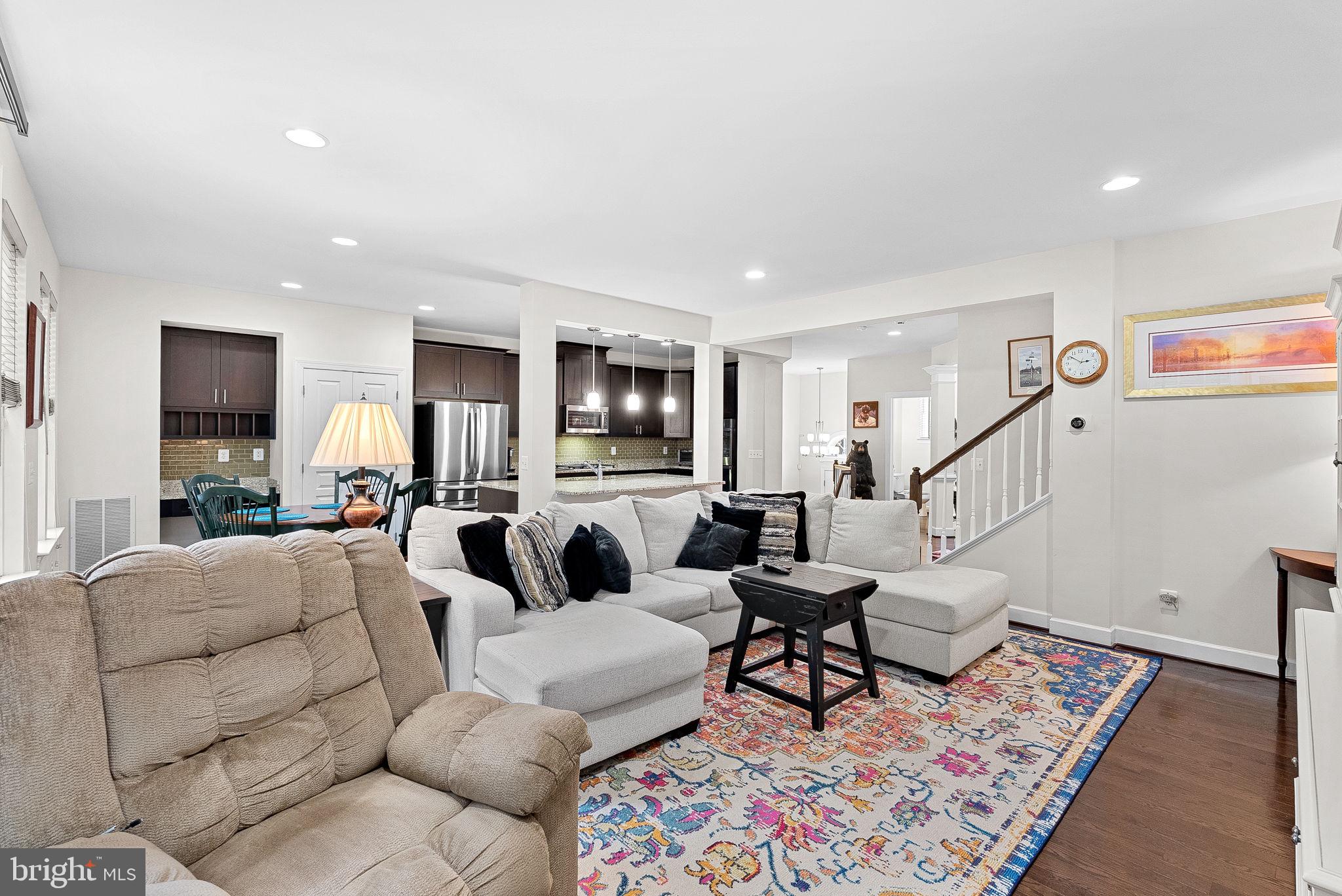 20281 Center Brook Square Sterling, VA 20165 - Photo 8 of 51 a living room with furniture wooden floor and a table