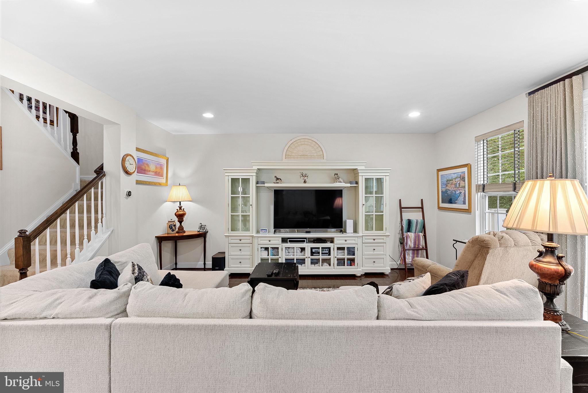 20281 Center Brook Square Sterling, VA 20165 - Photo 10 of 51 a living room with furniture and a flat screen tv