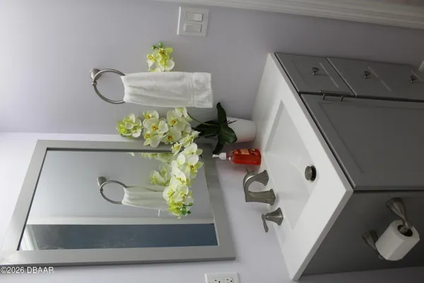 a utility room with painting and a lamp