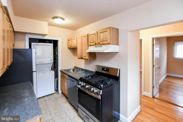 a kitchen with granite countertop cabinets and steel stainless steel appliances