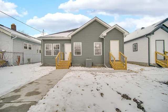 a view of a house with large windows