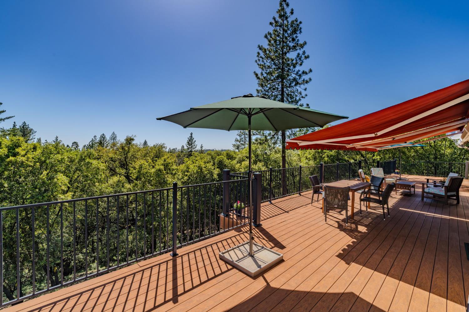 18299 West Clinton Road Jackson, CA 95642 - Photo 19 of 56 a view of balcony with chairs and umbrella