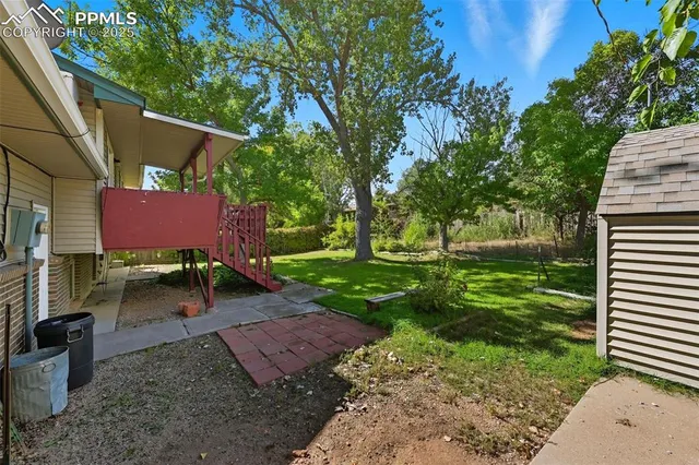 a view of a backyard with a garden