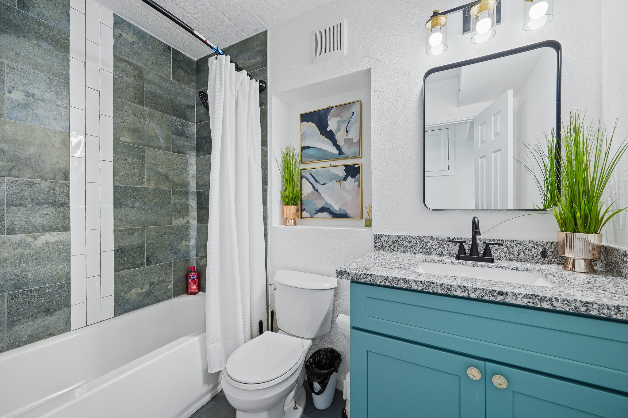 815 5th Street Dickinson, TX 77539 - Photo 31 of 49 a bathroom with a granite countertop sink toilet and shower