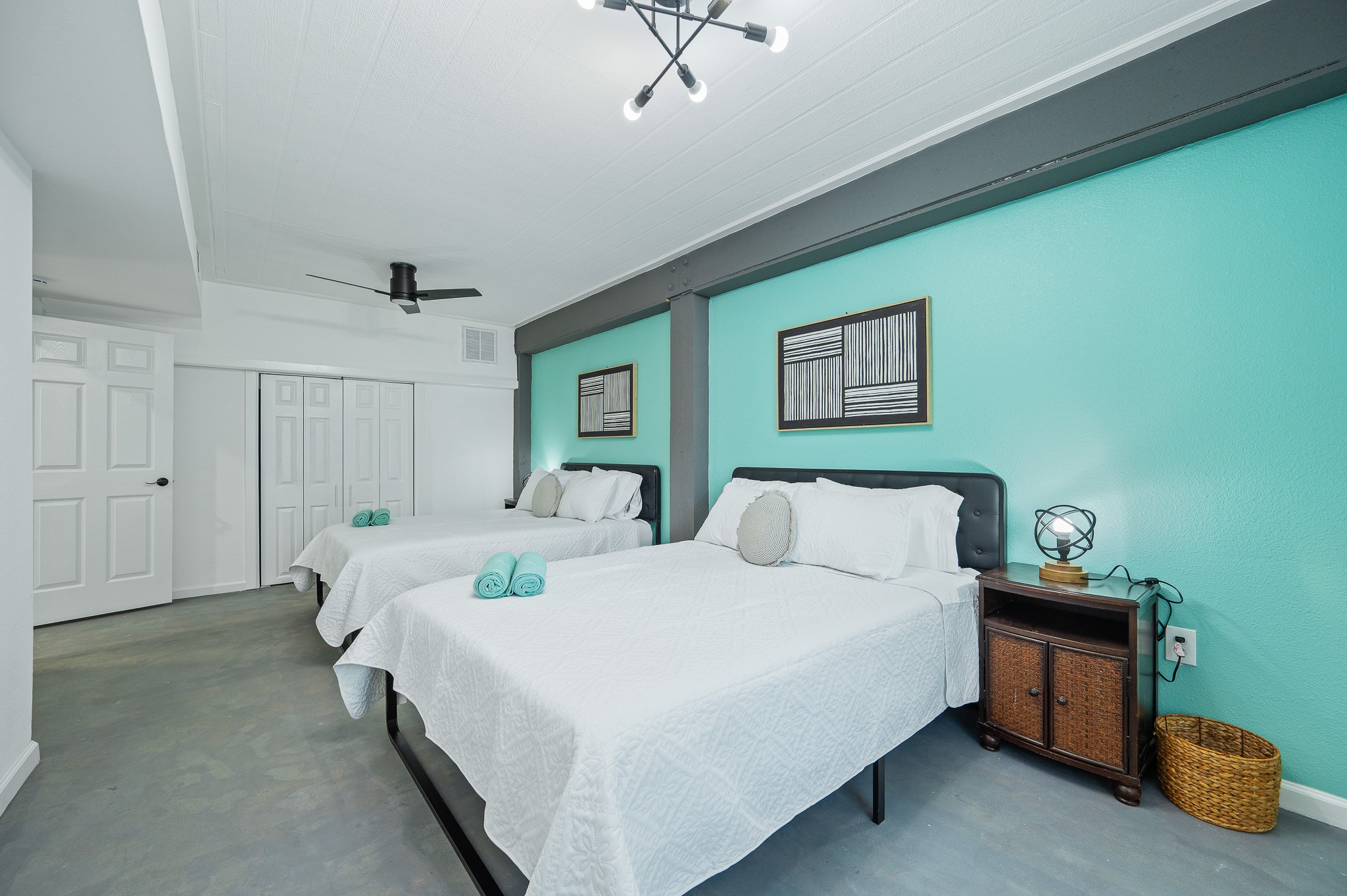 815 5th Street Dickinson, TX 77539 - Photo 41 of 49 a bedroom with a bed and a chandelier