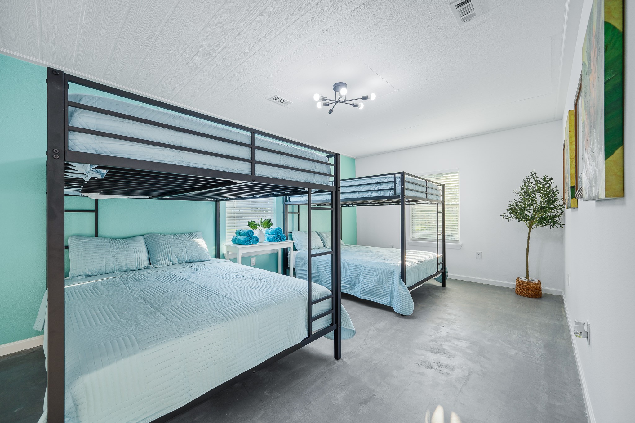 815 5th Street Dickinson, TX 77539 - Photo 43 of 49 a bedroom with a bed and a chandelier