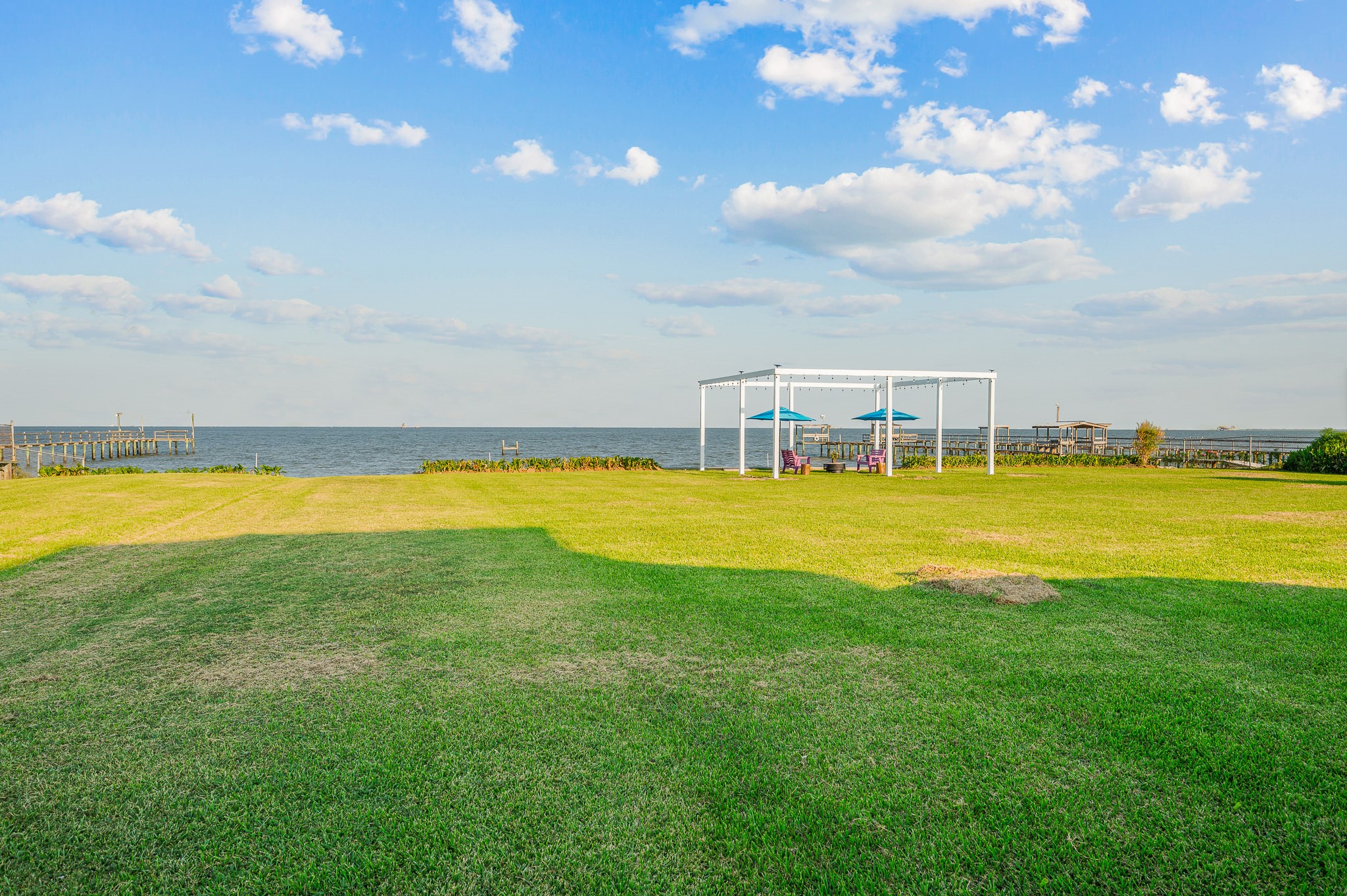 815 5th Street Dickinson, TX 77539 - Photo 8 of 49 a view of a swimming pool with an outdoor seating and yard