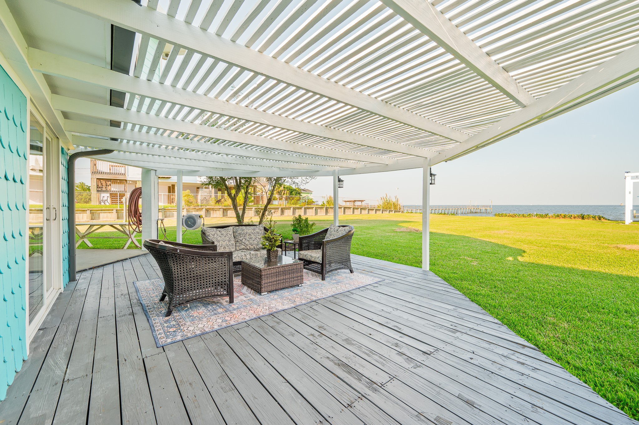 815 5th Street Dickinson, TX 77539 - Photo 9 of 49 a patio with lawn chairs with wooden floor