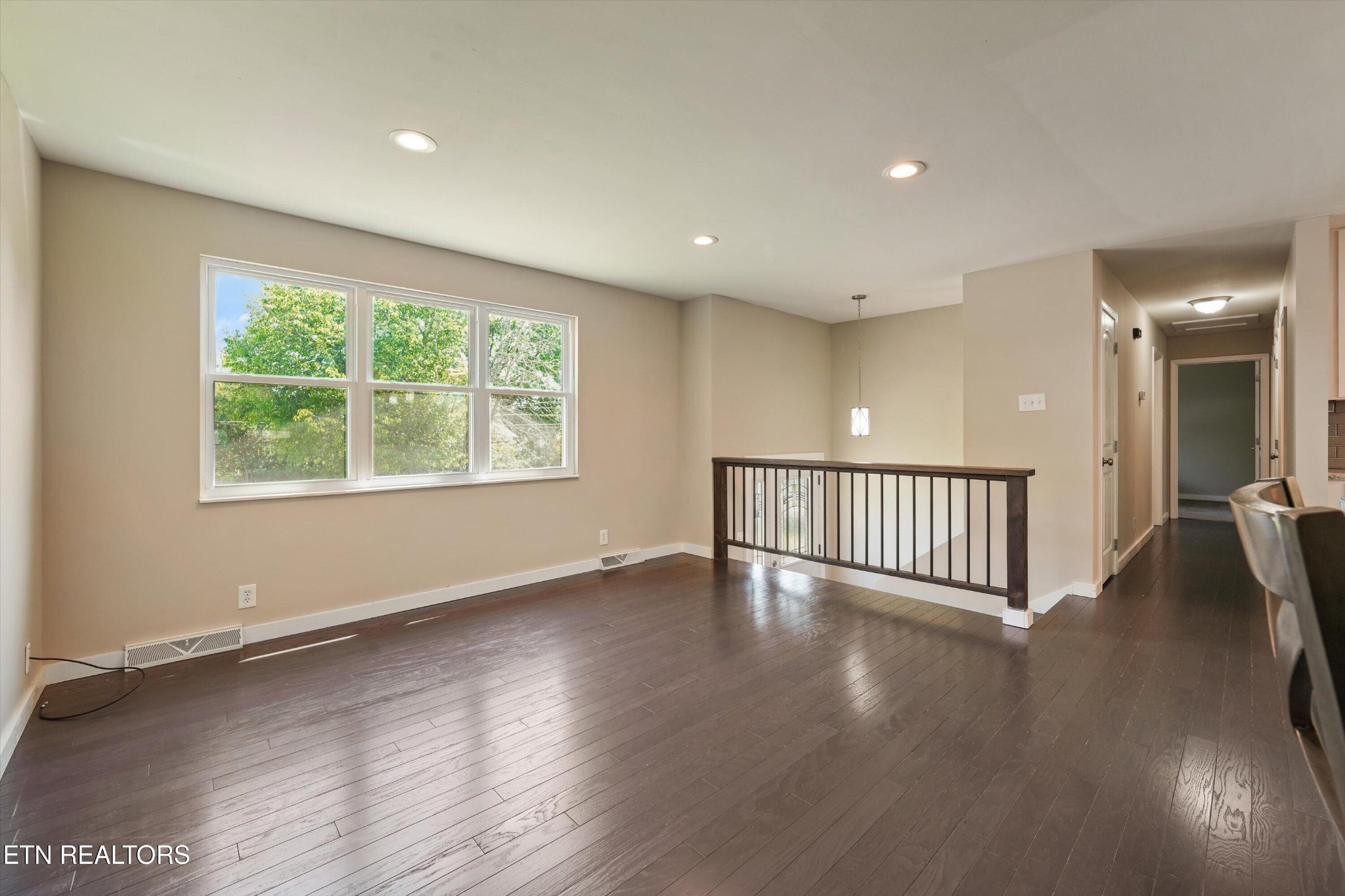 7613 Fall Wind Court Powell, TN 37849 - Photo 13 of 38 a view of an empty room with wooden floor and a window
