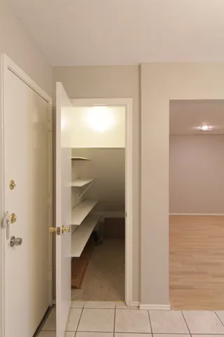a bathroom with a shower and a glass door