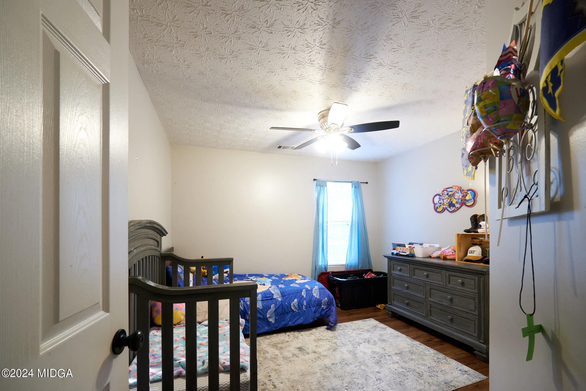 625 Windsor Drive Monroe, GA 30656 - Photo 13 of 27 a bedroom with furniture and a window