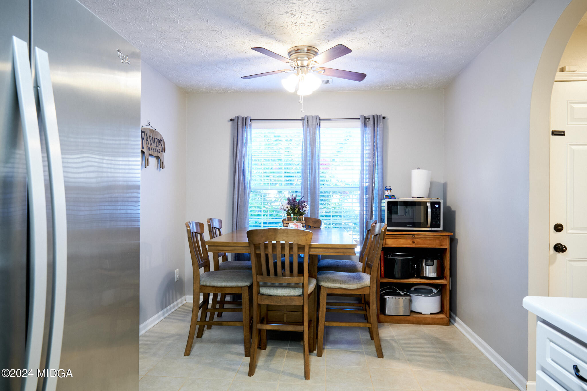 625 Windsor Drive Monroe, GA 30656 - Photo 15 of 27 a dining room with furniture and window