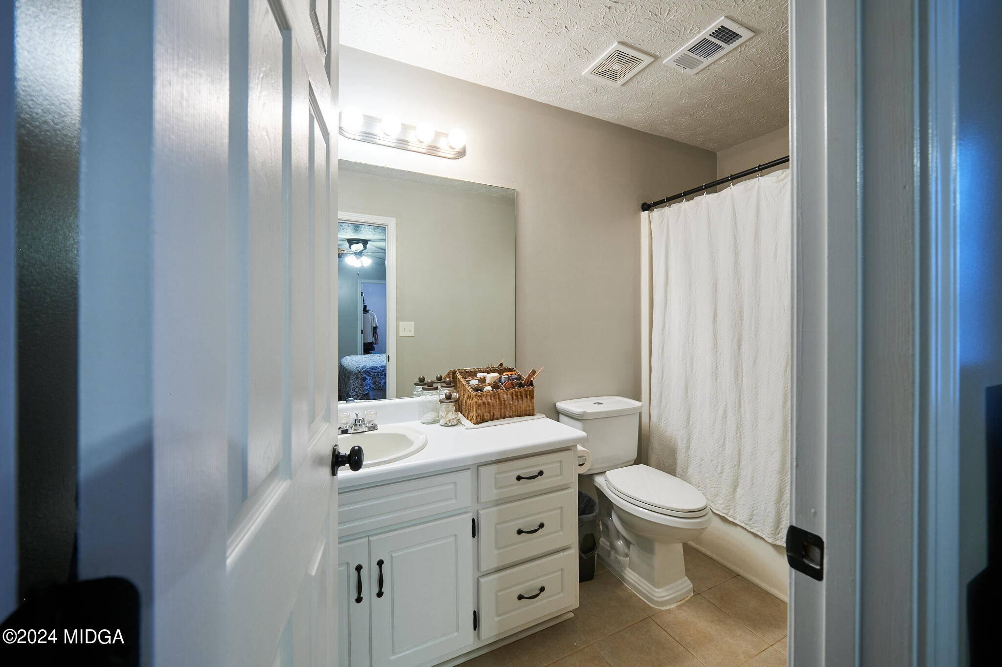 625 Windsor Drive Monroe, GA 30656 - Photo 20 of 27 a bathroom with a toilet sink and mirror