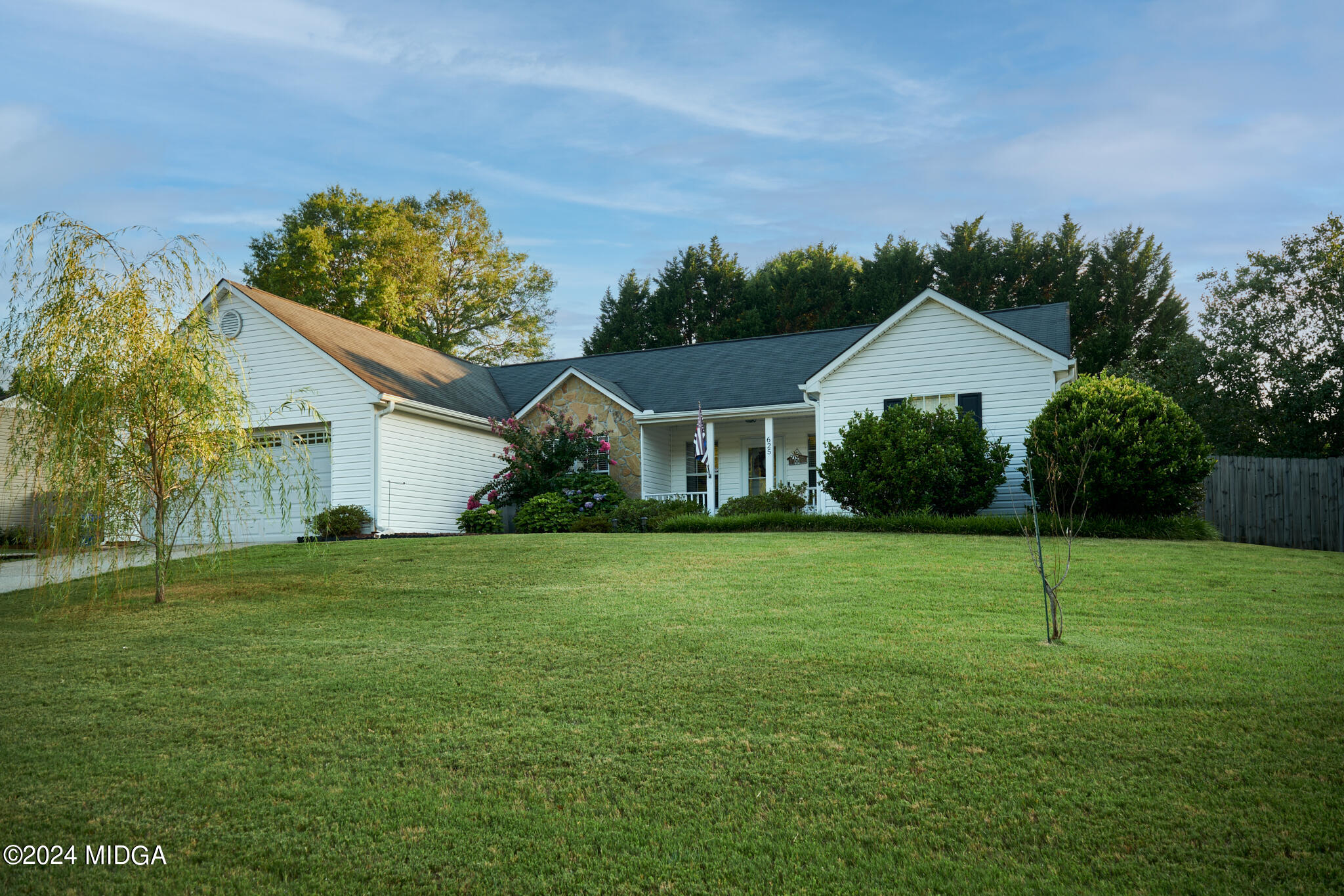 625 Windsor Drive Monroe, GA 30656 - Photo 25 of 27 a front view of a house with a yard