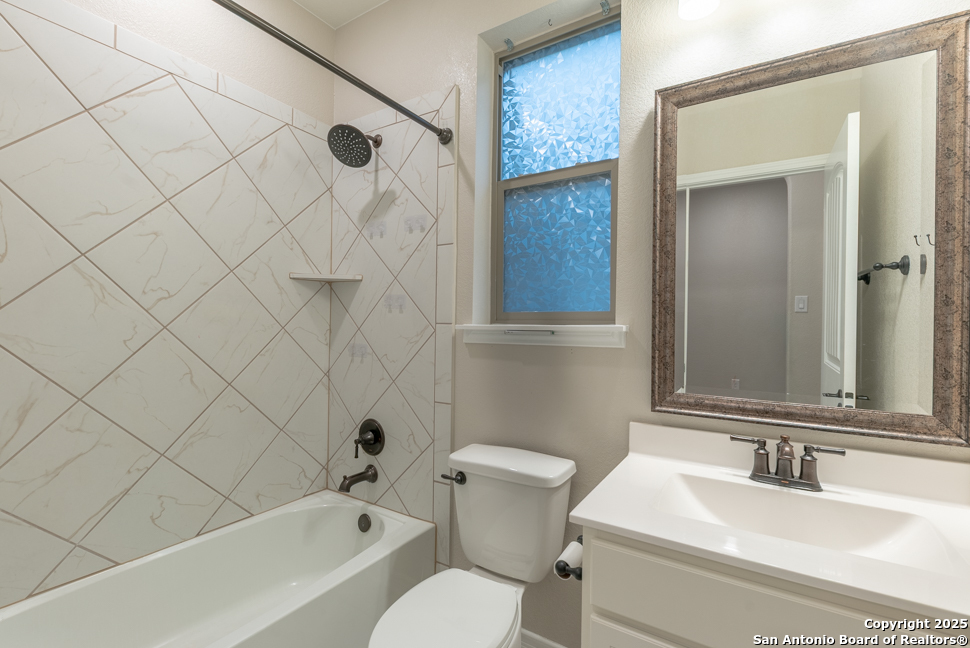 8026 San Mirienda Boerne, TX 78015 - Photo 13 of 29 a bathroom with a toilet sink and shower
