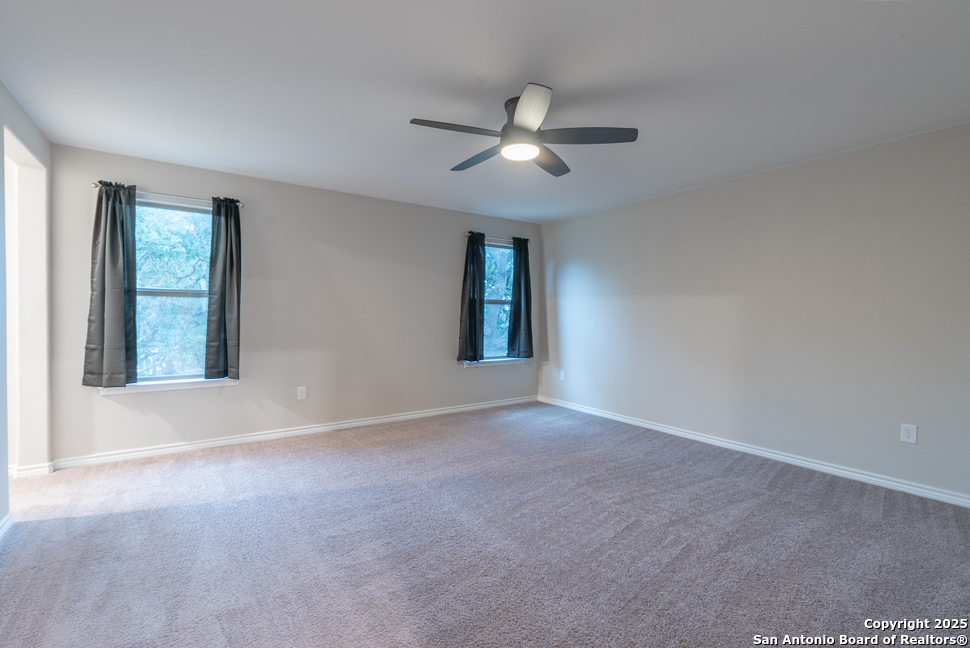 8026 San Mirienda Boerne, TX 78015 - Photo 16 of 29 a view of an empty room with a window