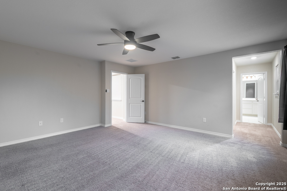 8026 San Mirienda Boerne, TX 78015 - Photo 18 of 29 a view of an empty room with a ceiling fan