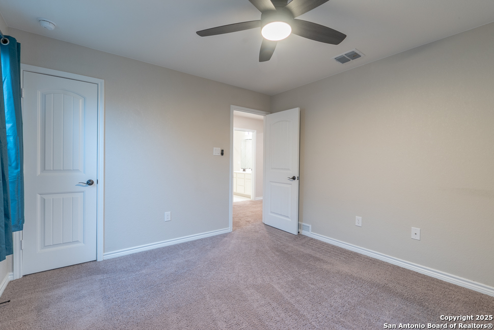 8026 San Mirienda Boerne, TX 78015 - Photo 21 of 29 an empty room with a empty space and a ceiling fan