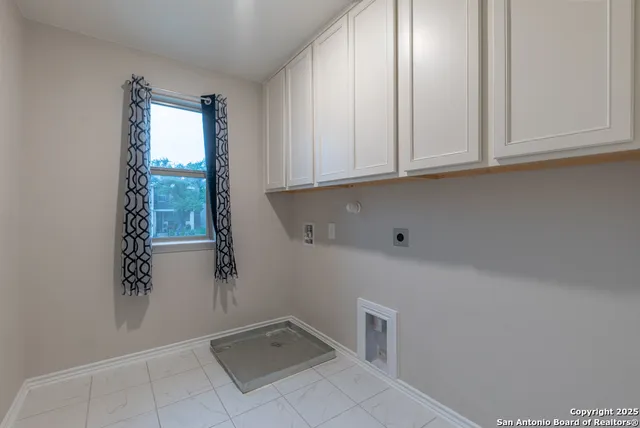 a view of cabinets and window