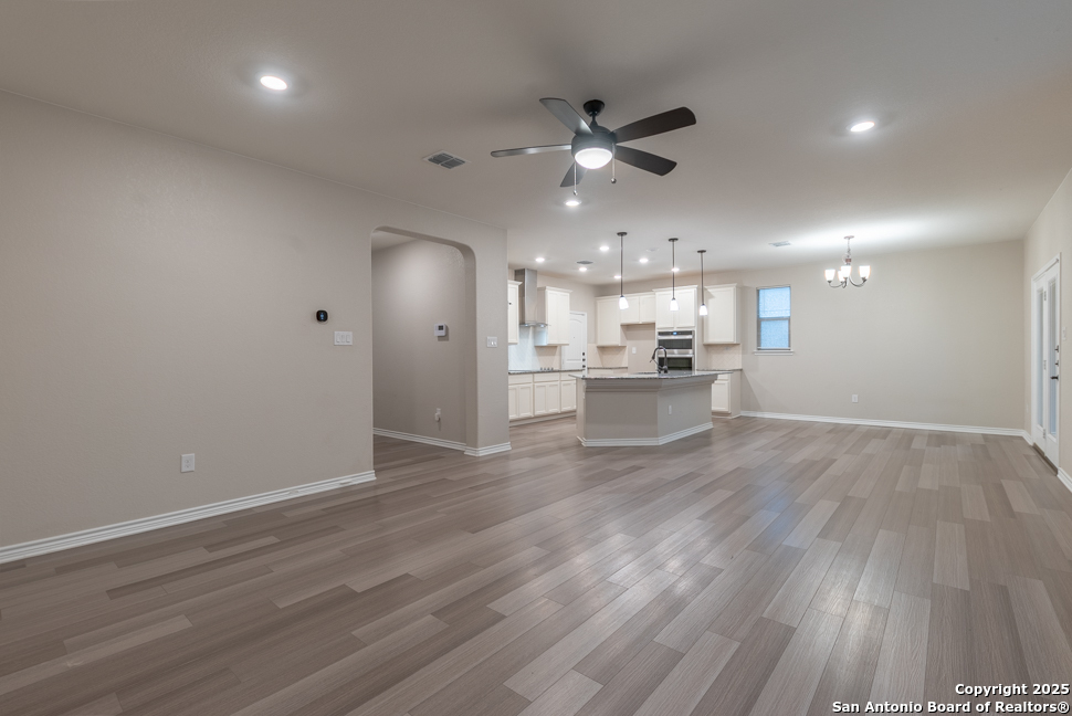 8026 San Mirienda Boerne, TX 78015 - Photo 3 of 29 a view of a kitchen with a dishwasher stove top oven and cabinets