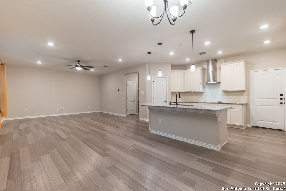 8026 San Mirienda Boerne, TX 78015 - Photo 4 of 29 a large kitchen with kitchen island a sink stainless steel appliances and cabinets