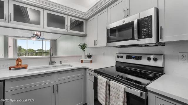 a kitchen with a stove and a microwave
