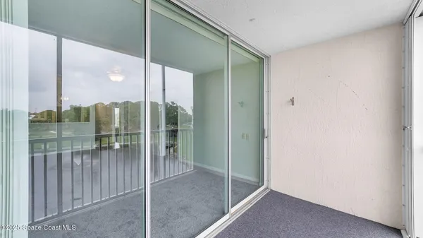 a view of a bathroom with a glass door
