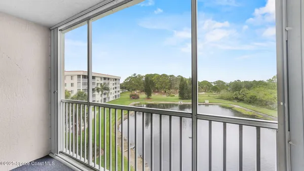 a view of a balcony with furniture