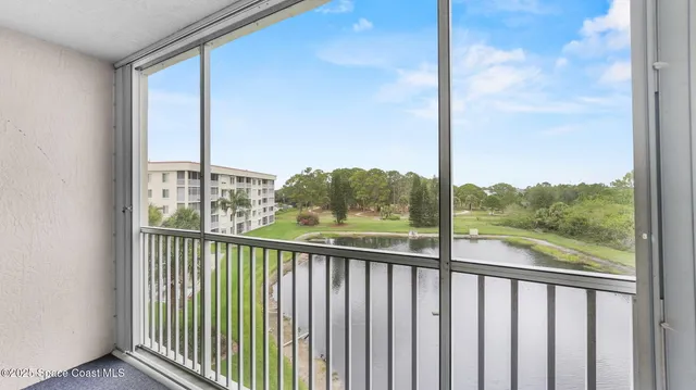 a view of a balcony with furniture