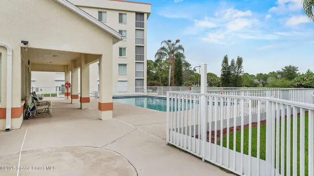 a view of a porch with wooden fence and floor