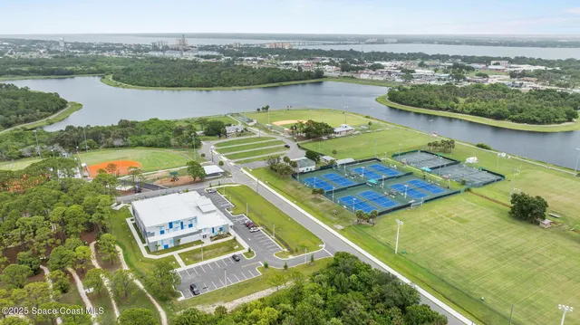 an aerial view of a house with a lake view