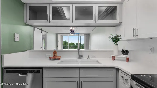 a kitchen with a sink and cabinets