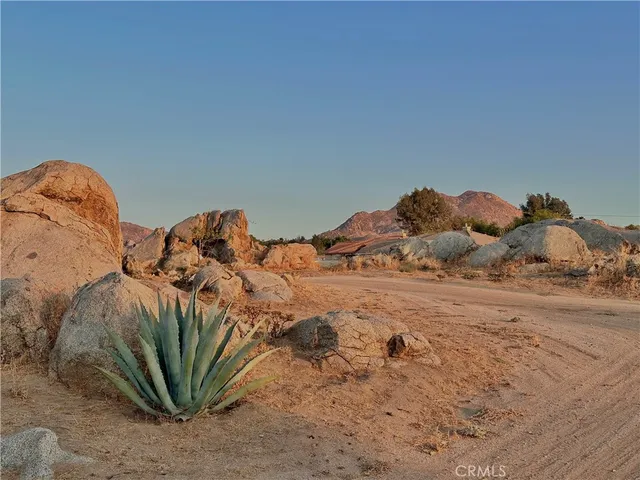 a view of a bed in a bedroom