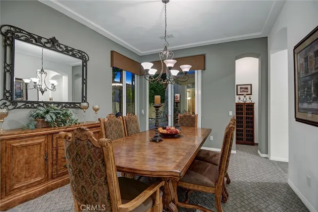 a view of a dining room with furniture and window