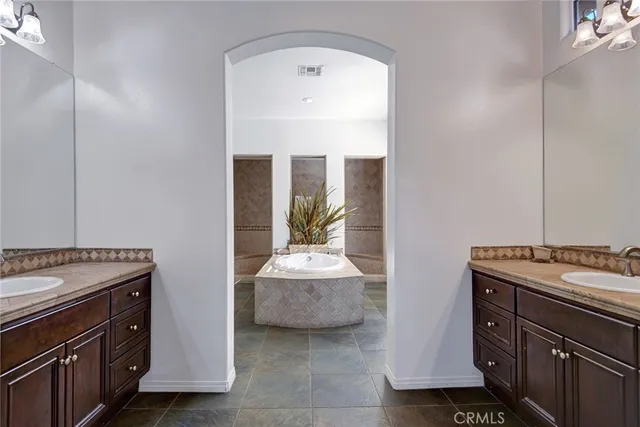 a bedroom with a stove and a sink
