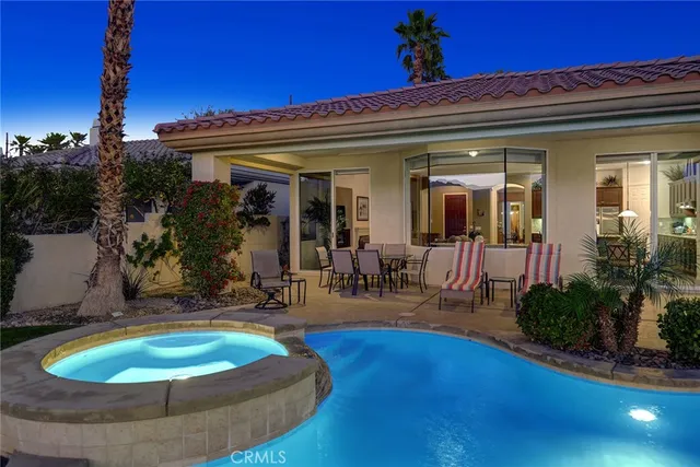 a view of a house with outdoor seating