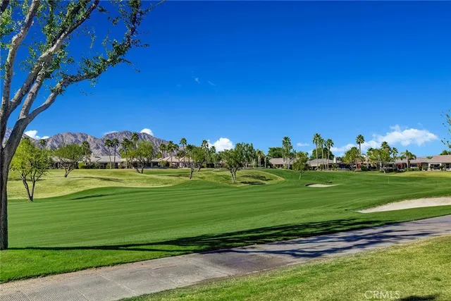 a view of a golf course with a big yard