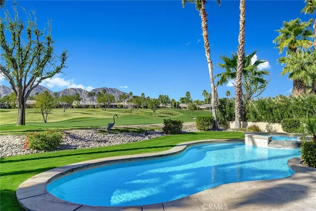 a view of a golf course with a house