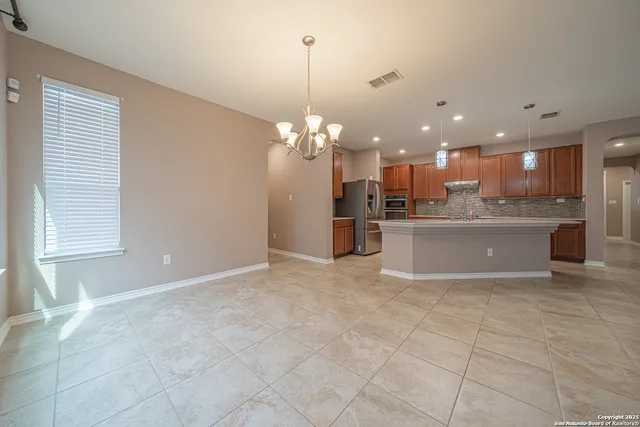 a view of a kitchen and a chandelier