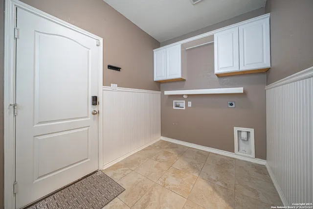 a view of kitchen with stainless steel appliances granite countertop refrigerator sink and stove