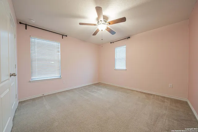 a white toilet sitting next to a bath tub
