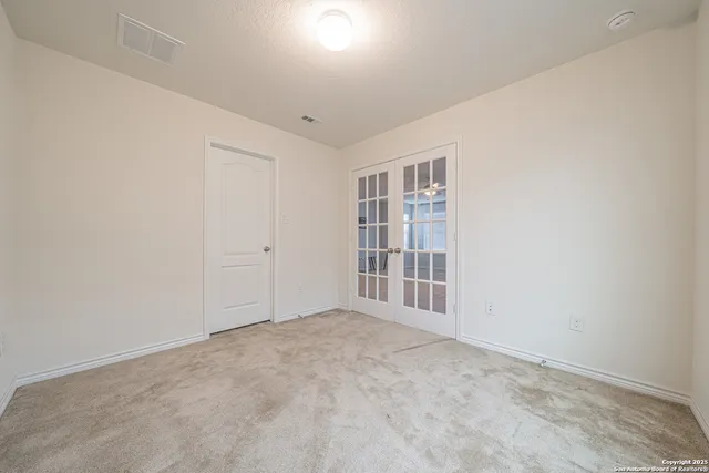 a kitchen with stainless steel appliances granite countertop a sink and refrigerator